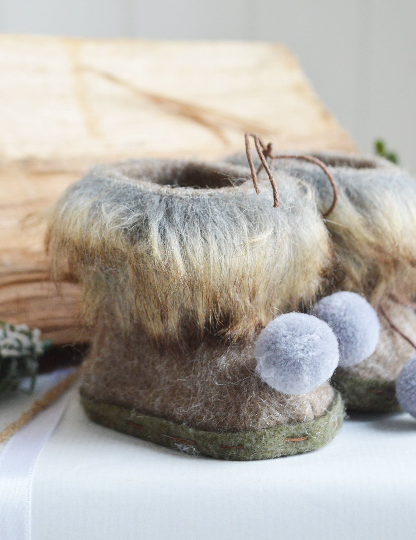 New England style Christmas Decor for cottage, farmhouse, coastal, country and city homes and interiors. Faux Fur boots - Ski Lodge New England style Christmas Decor