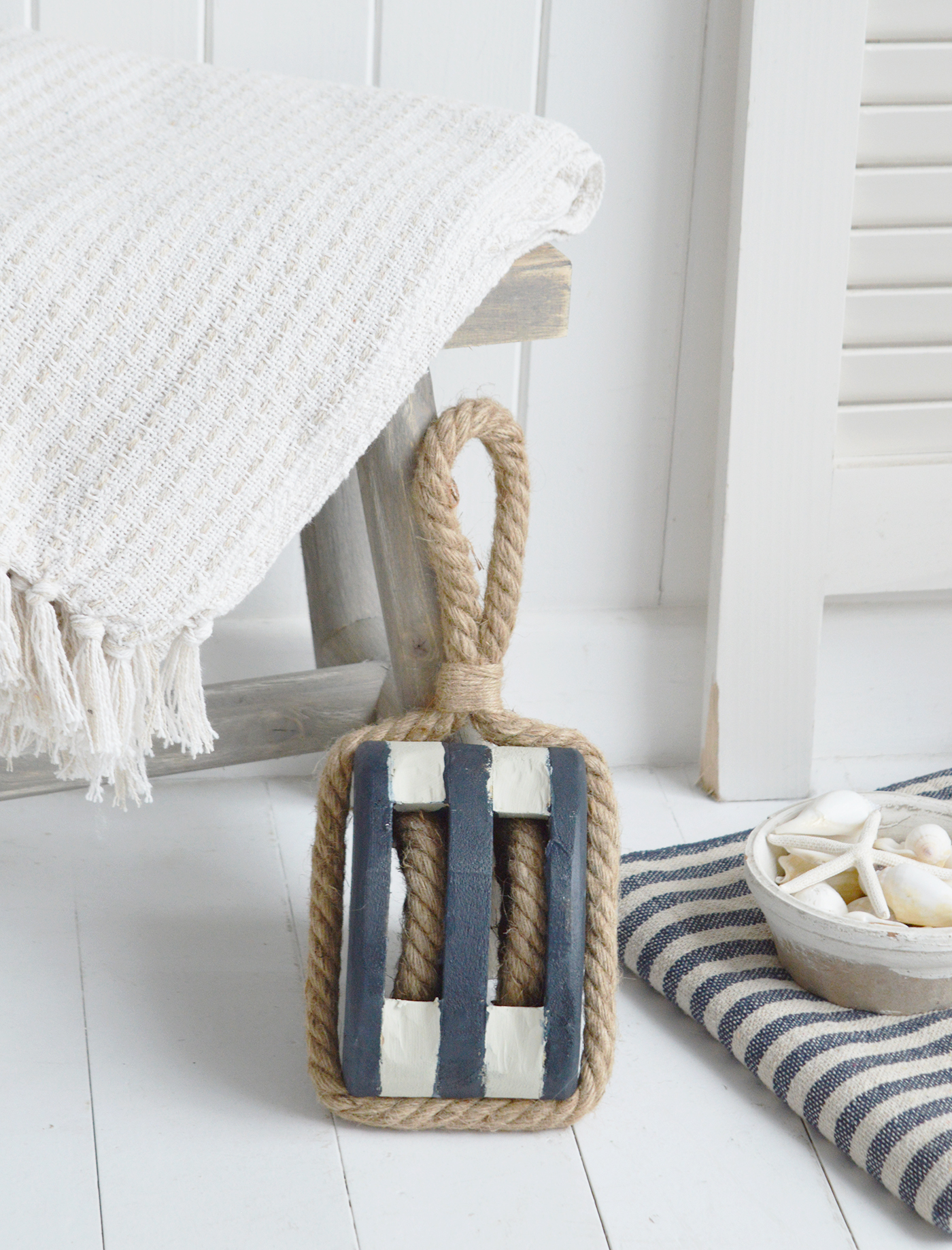 Wooden rope pulley decoration styled for coastal interiors with nautical charm