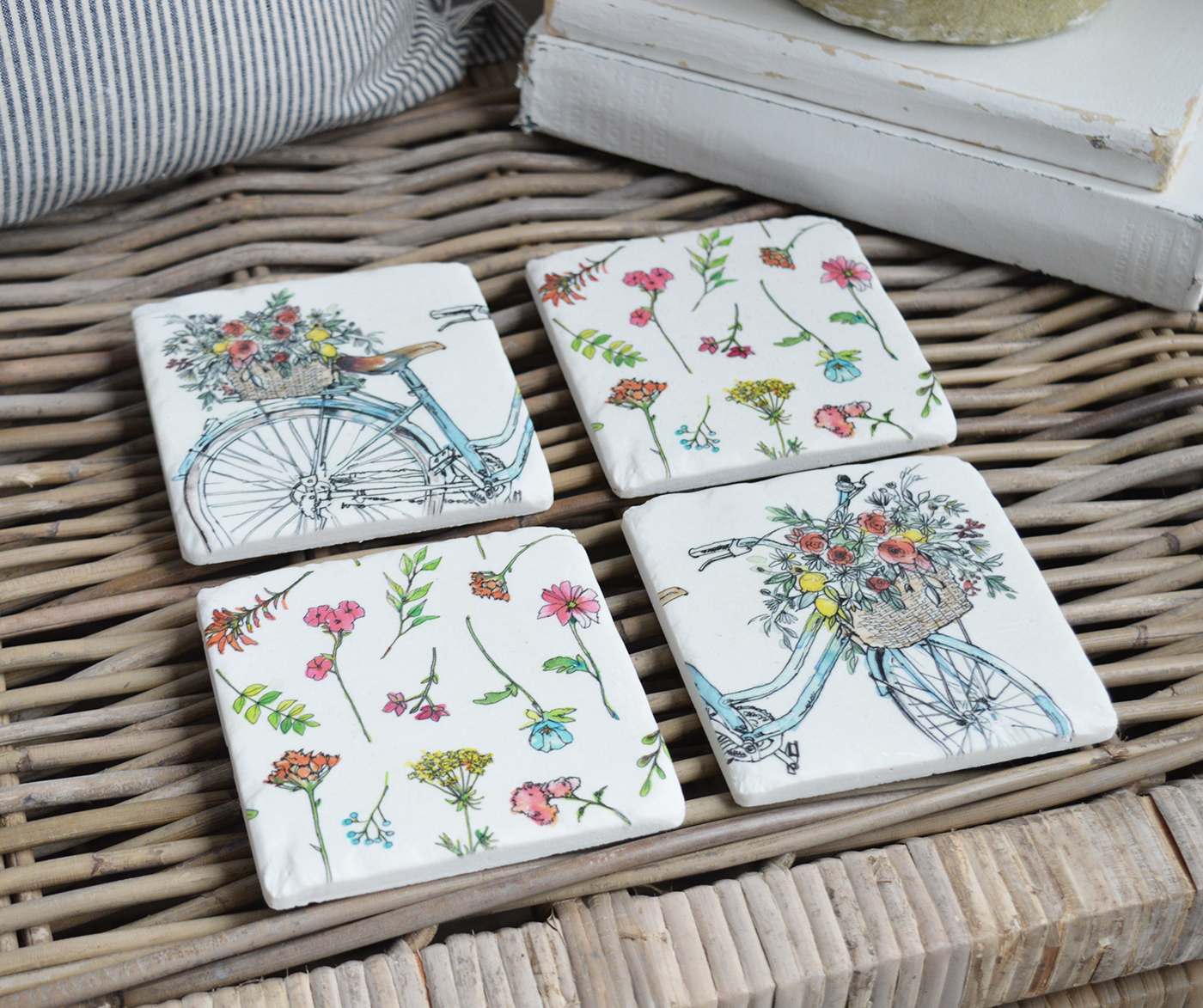 New England style home interiors from The White Lighthouse Furniture - Martha's Vineyard Coasters. A bicycle adorned with flowers, set against the backdrop of Martha’s Vineyard, captures the essence of the island’s charm and beauty