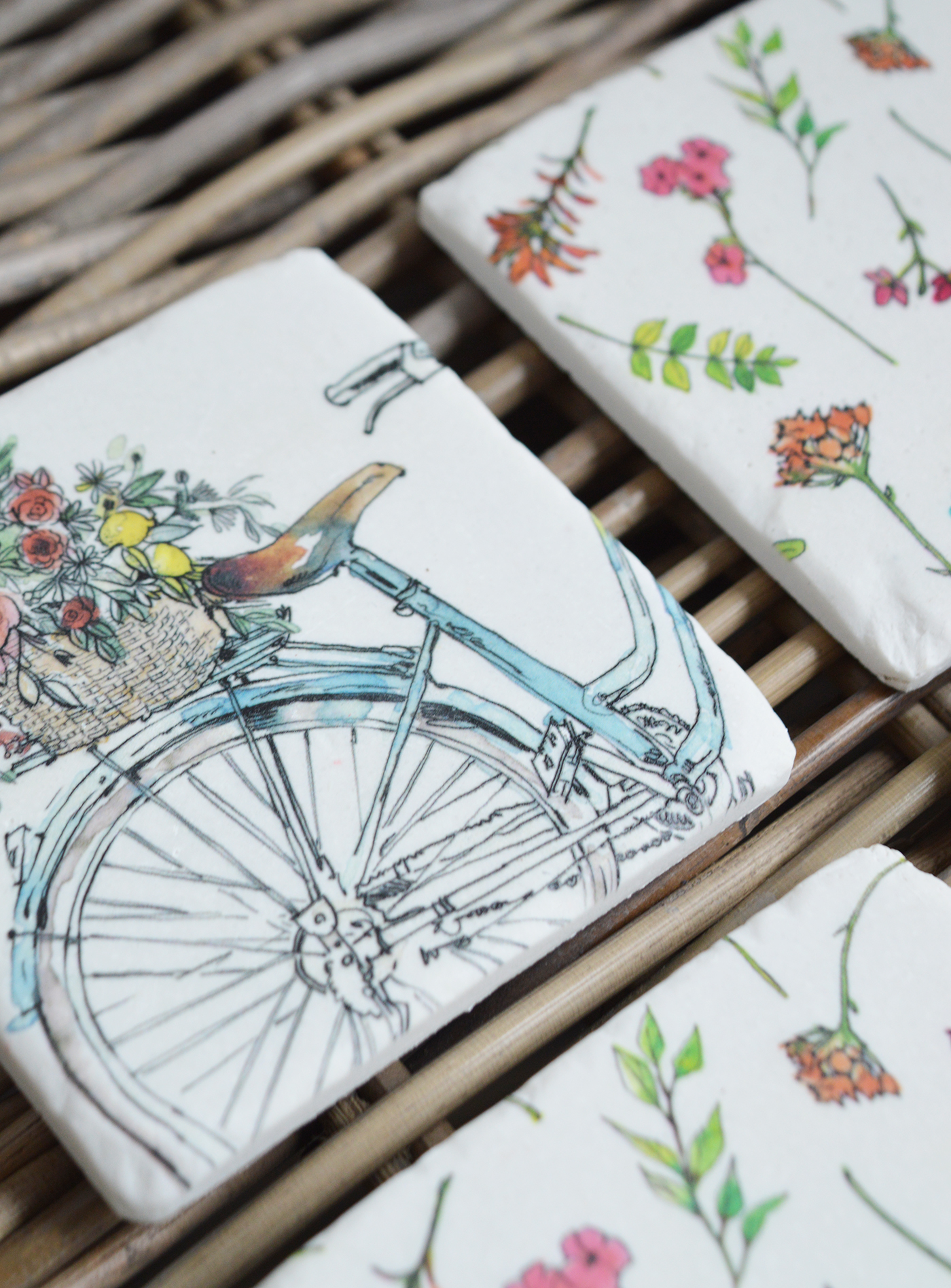 New England style home interiors from The White Lighthouse Furniture - Martha's Vineyard Coasters. A bicycle adorned with flowers, set against the backdrop of Martha’s Vineyard, captures the essence of the island’s charm and beauty