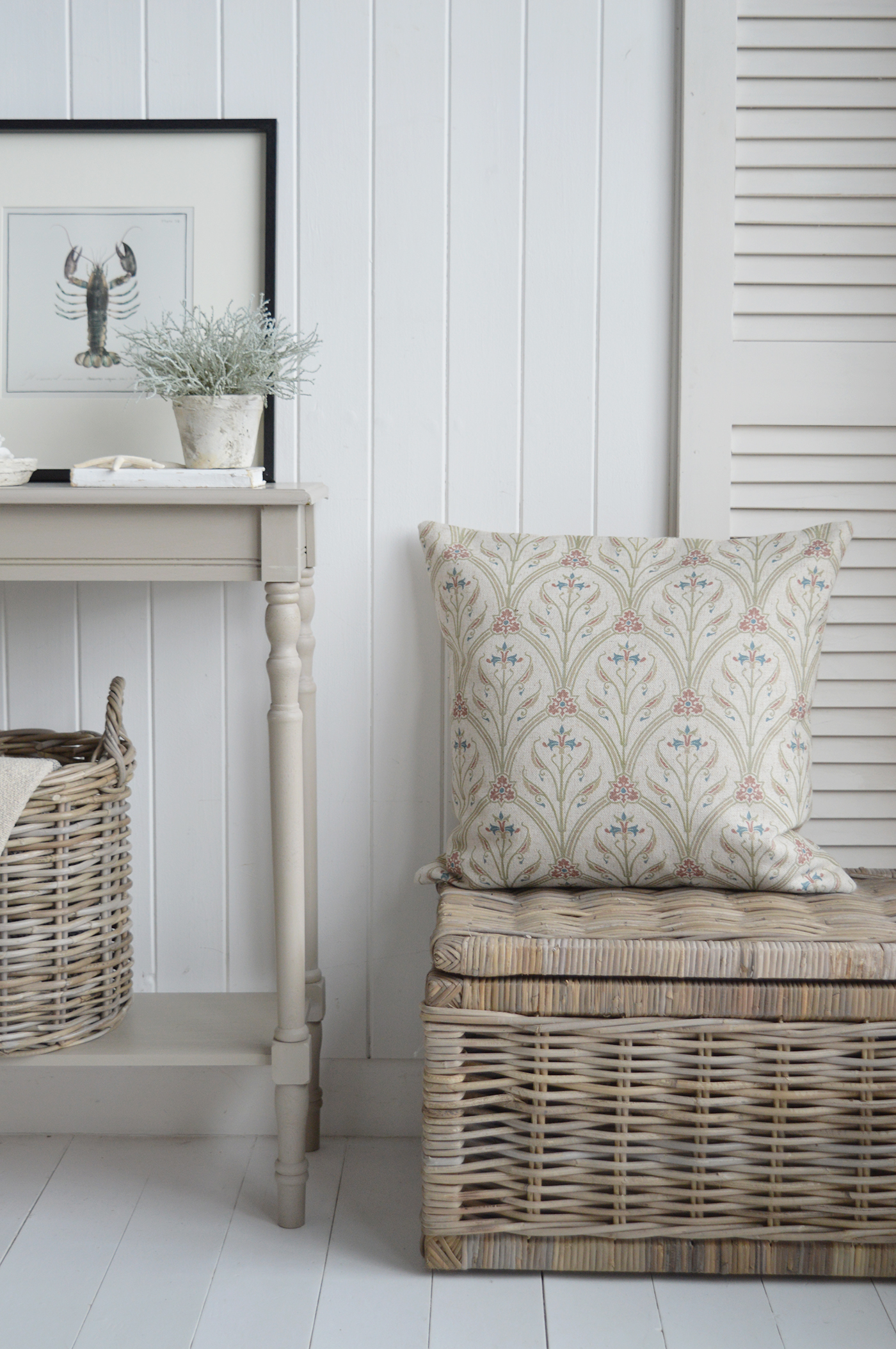 The Cotlon cushion on the textural basket table, complementing our New England style of interiors