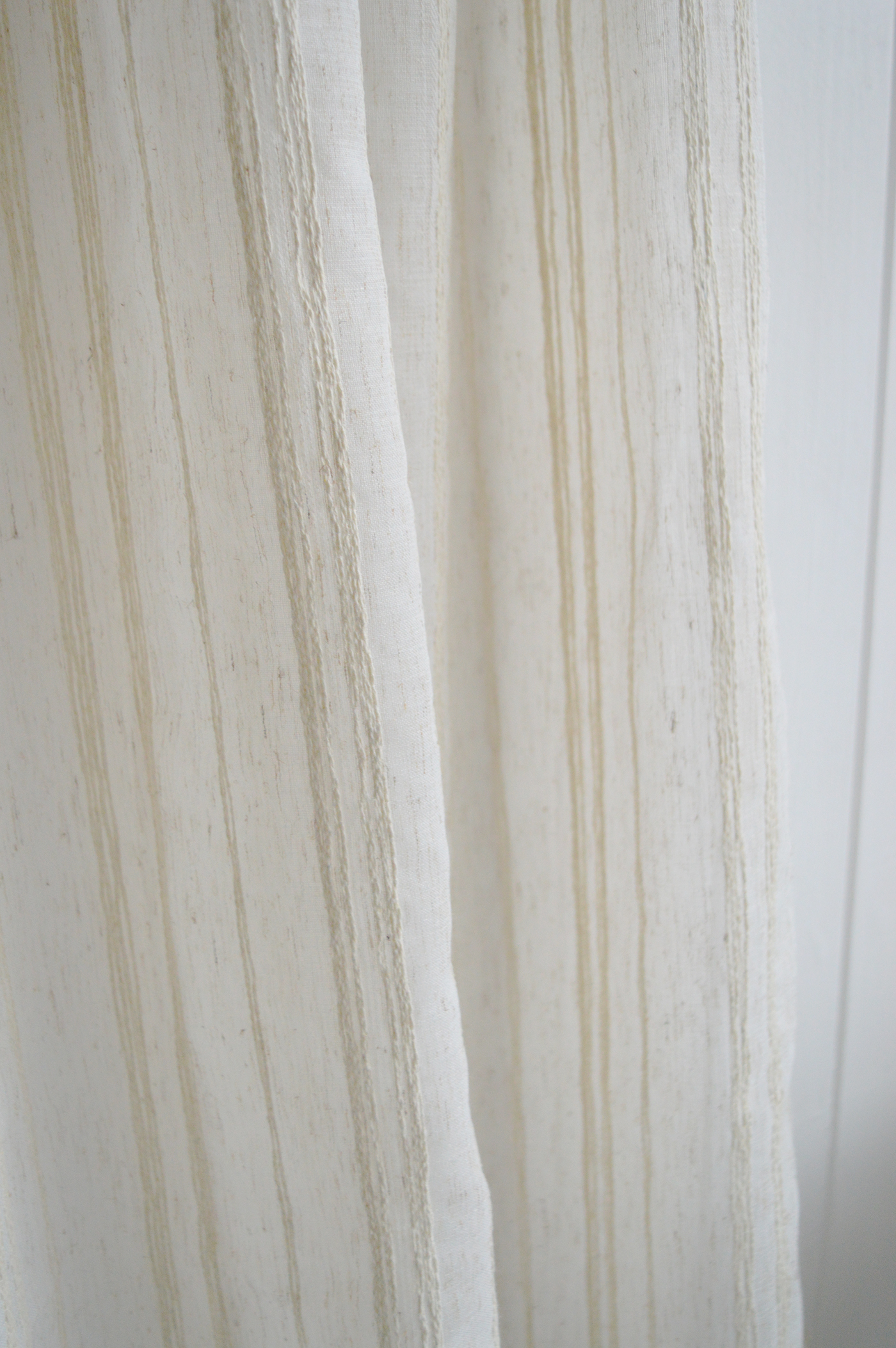 The Ivory Haven Stripe Curtain adds gentle texture and warmth to neutral interiors with its soft ivory palette and vertical woven detail.