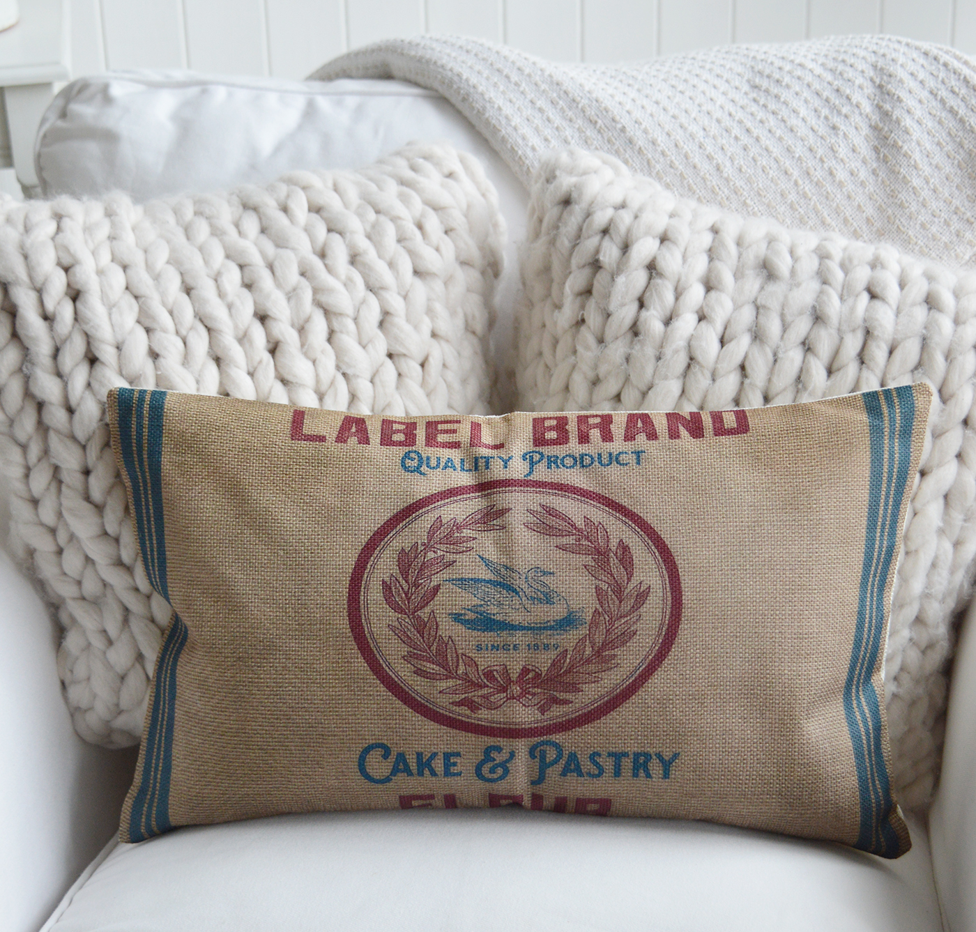 Crafted from a textured woven fabric, this cushion brings warmth and authenticity to any living space.