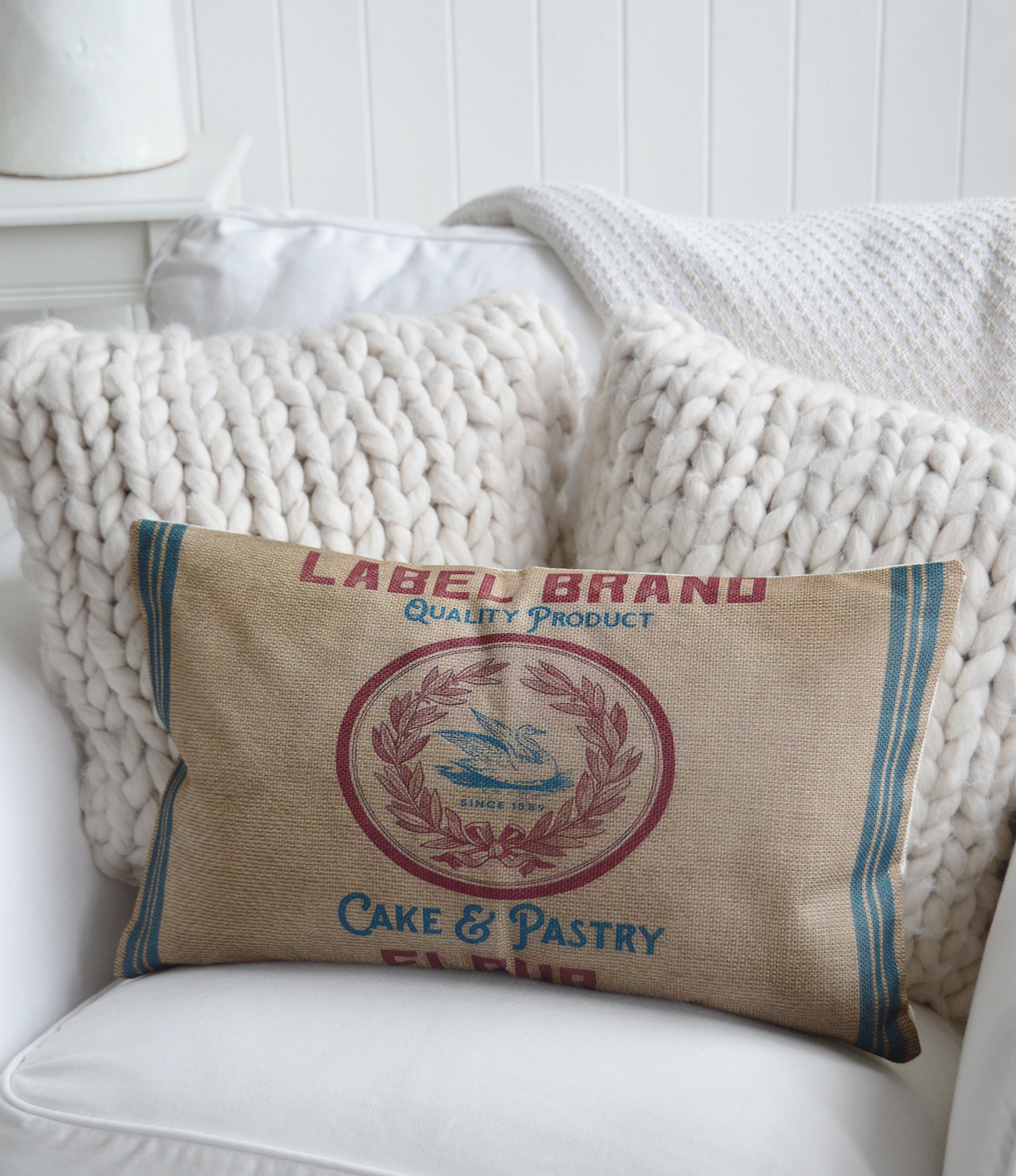 Layer the Belmont Cushion with striped or linen designs for a classic Hamptons or farmhouse aesthetic