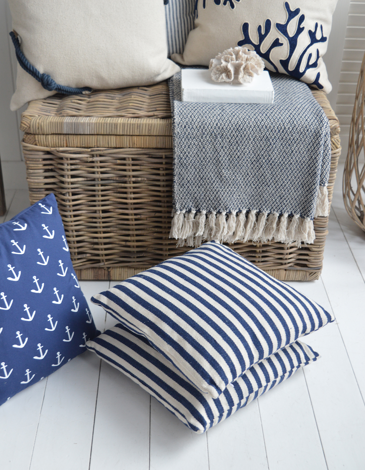 Harrison navy and white stripe Harrison coastal cushion. styled here with the Seaside basket and anchor cushion