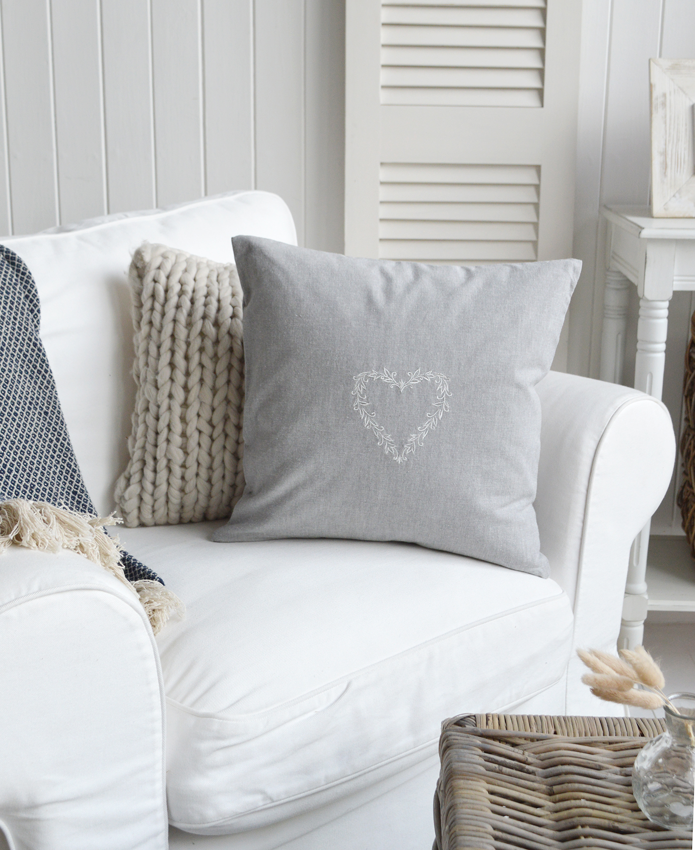 Decorative New England-style cushion with heart embroidery 