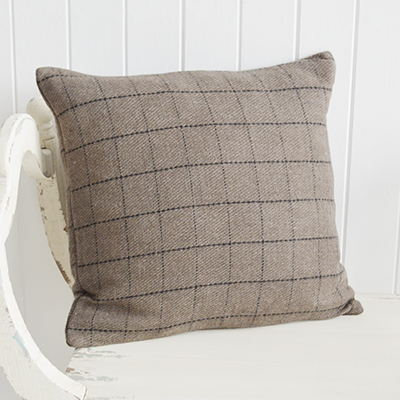 New England style interiors. A cushion in taupe and black check