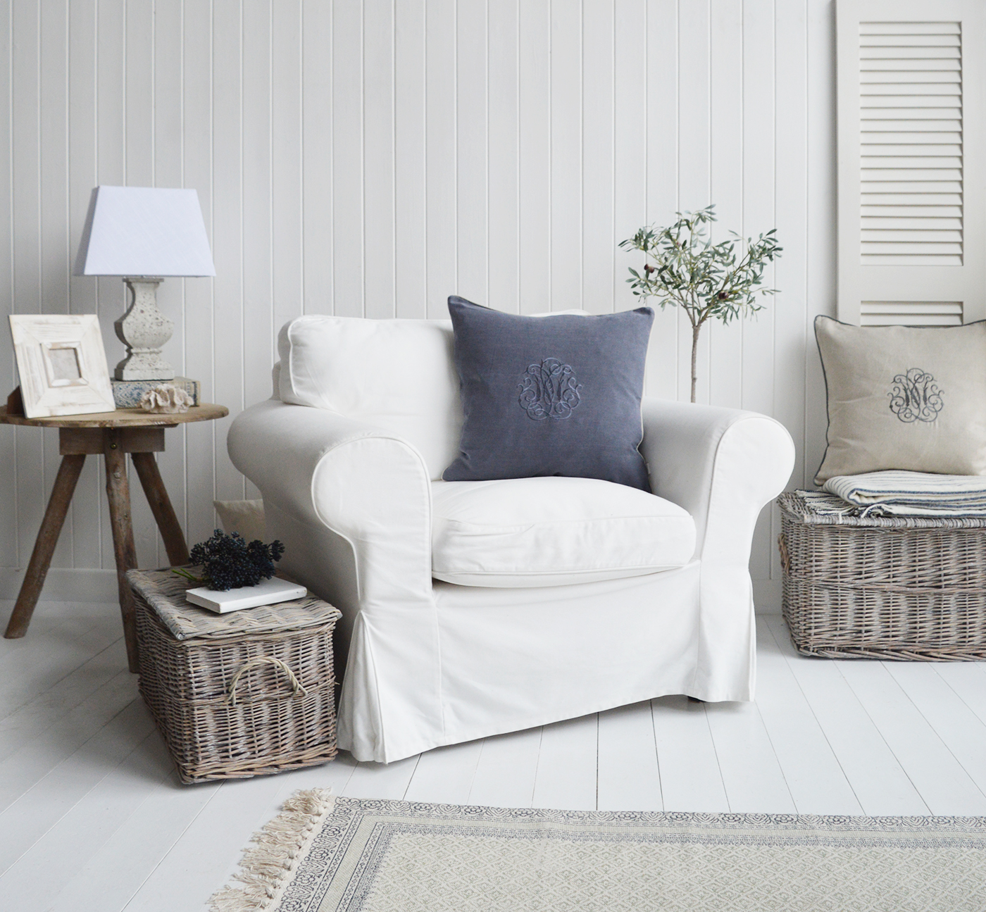 Set of 2 windsor baskets in a New England living room as side tables for storage and texture