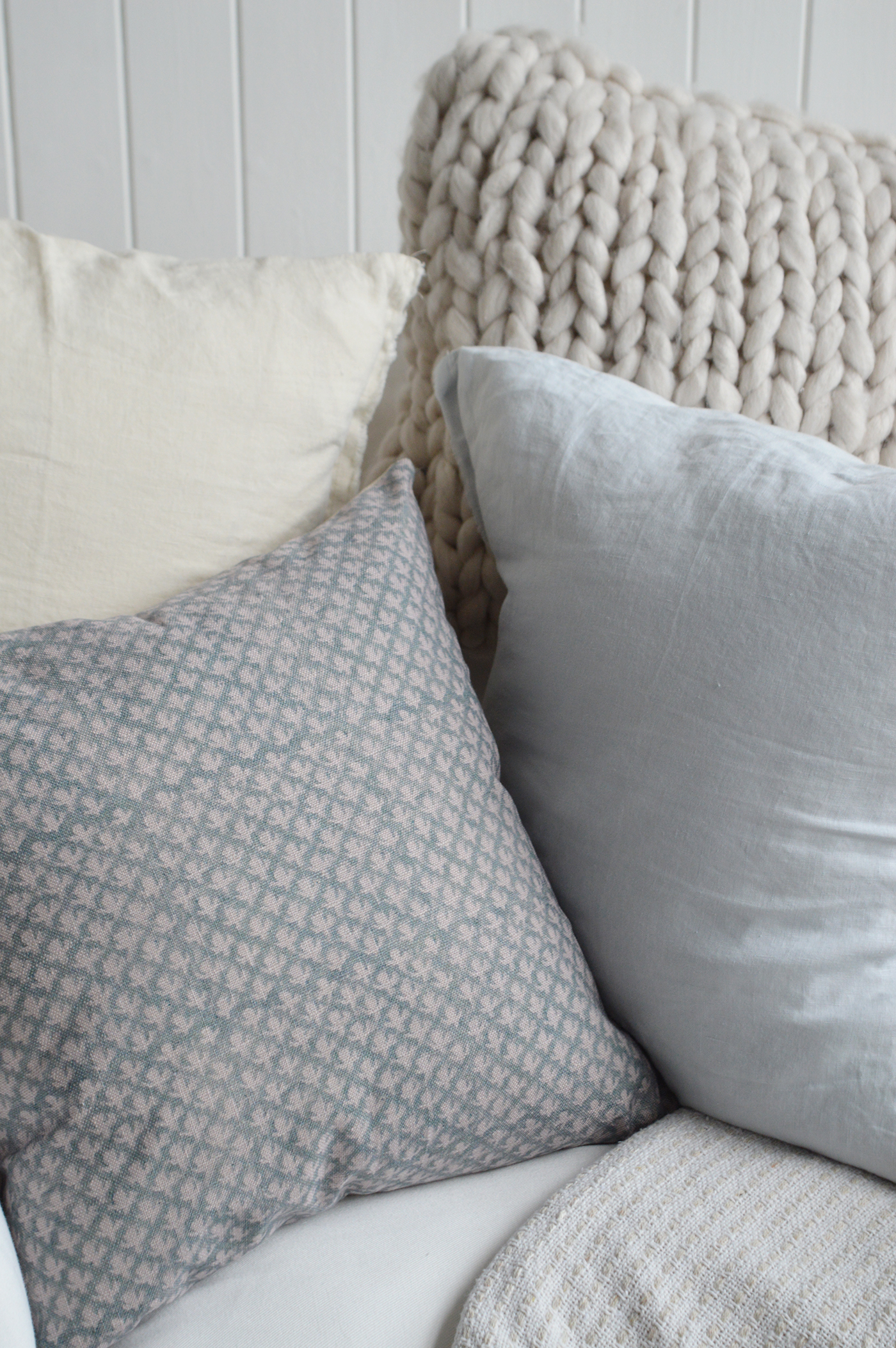 Nantucket-inspired cushion styled in a cozy coastal farmhouse setting