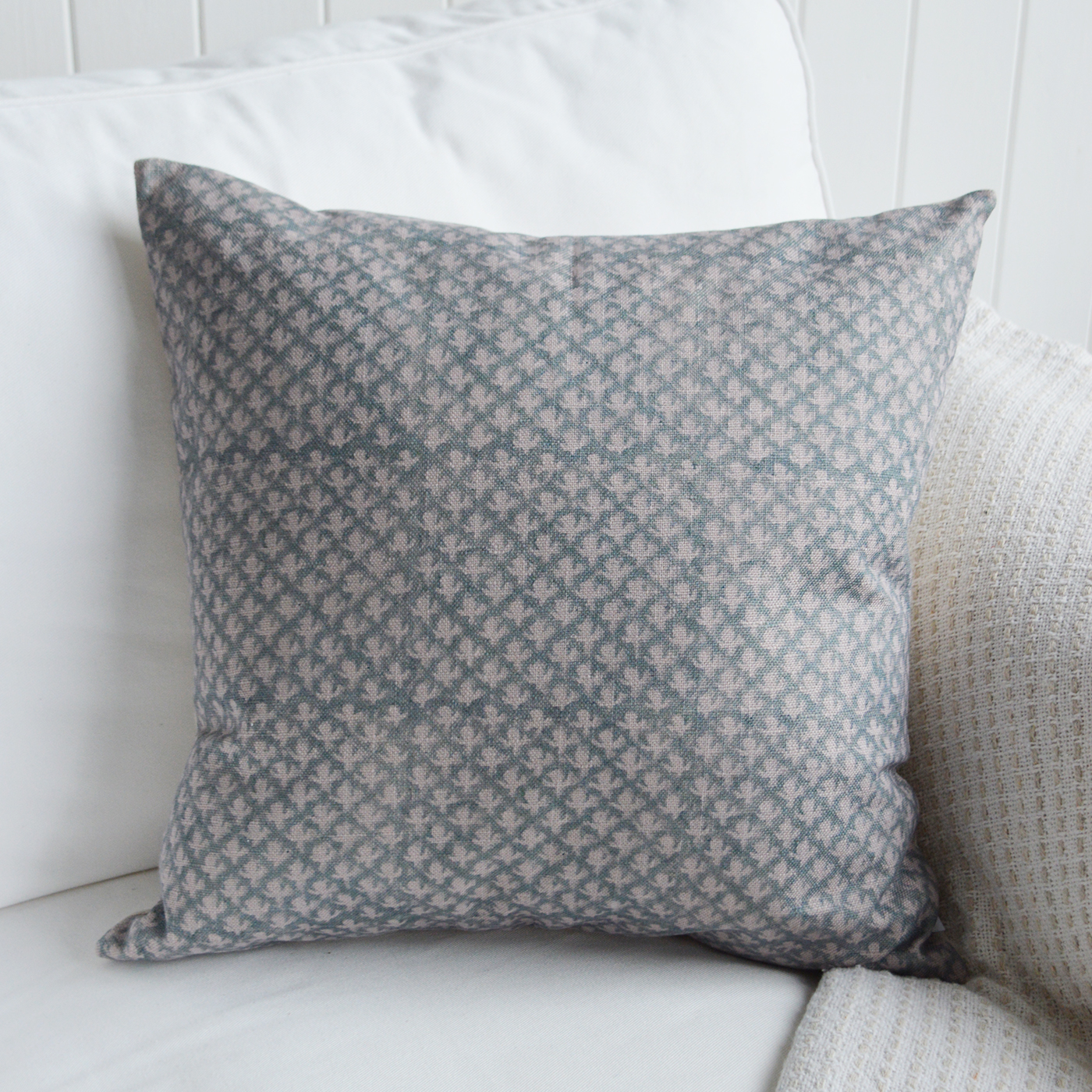 The Nantucket Soft blue floral cushion cover styled in a Hamptons-inspired living room