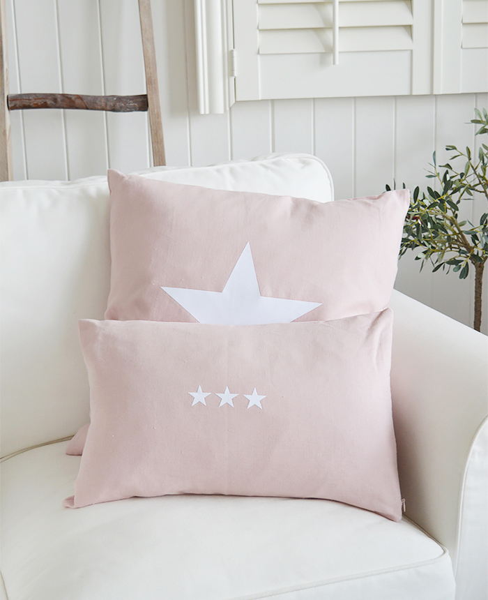 The New Hamptons pink and white cushions. Available with a larger single white star or three smaller stars from The White Lighthouse New England, country, coastal and white furniture for the hall, living room, bedroom and bathroom