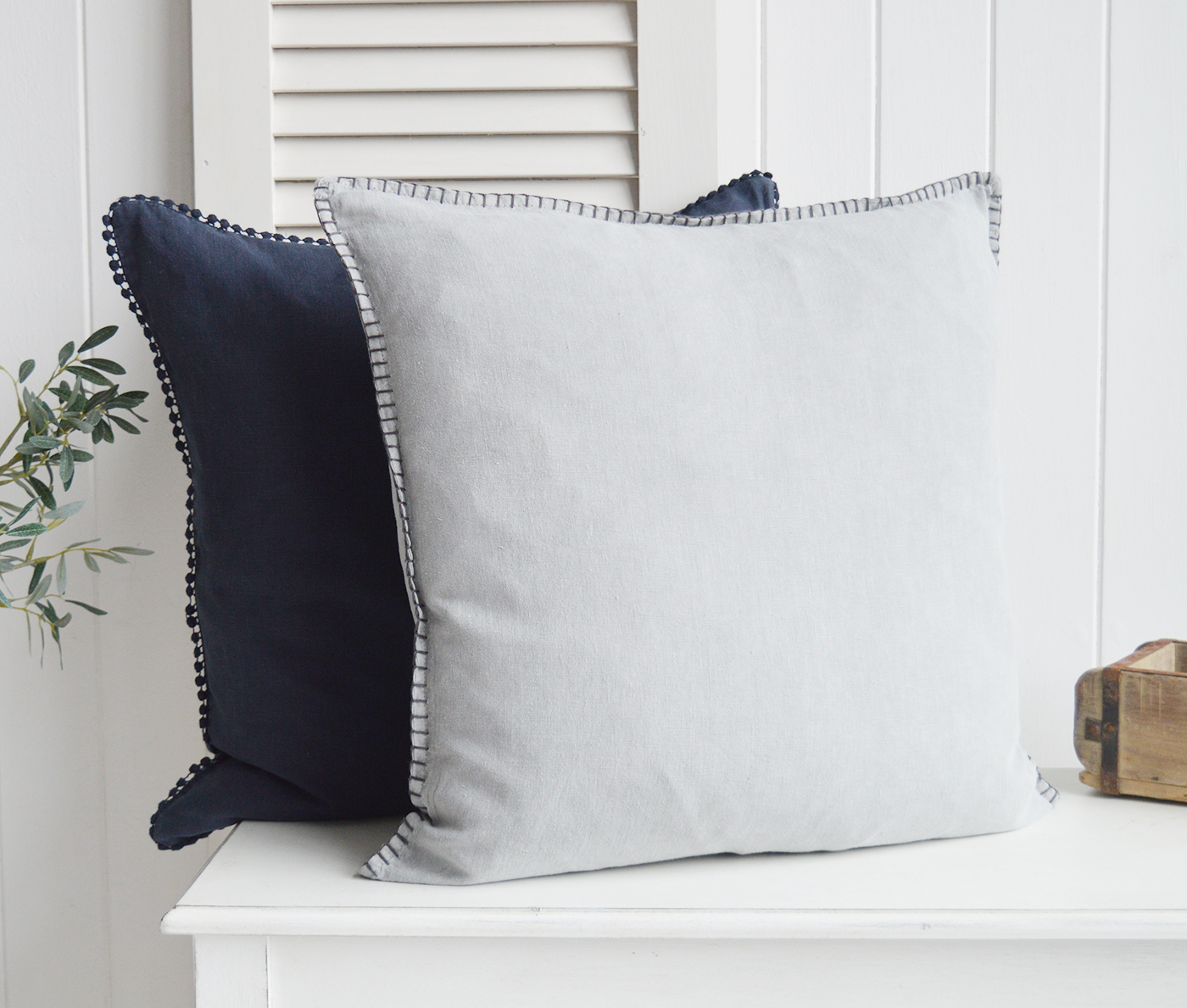 Grey linen cushion with charcoal stitching. New England interiors for coastal, country and modern farmhouse homes