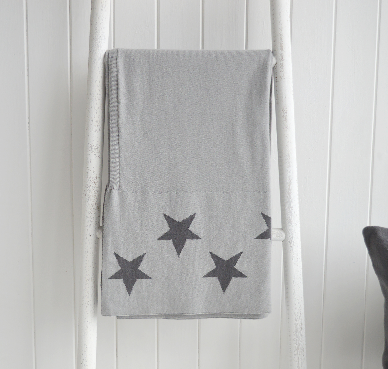 The White Lighthouse Furniture. New England style cushions and throw. Grey and white star filled cushion in square and rectangle for country, coastal and city homes