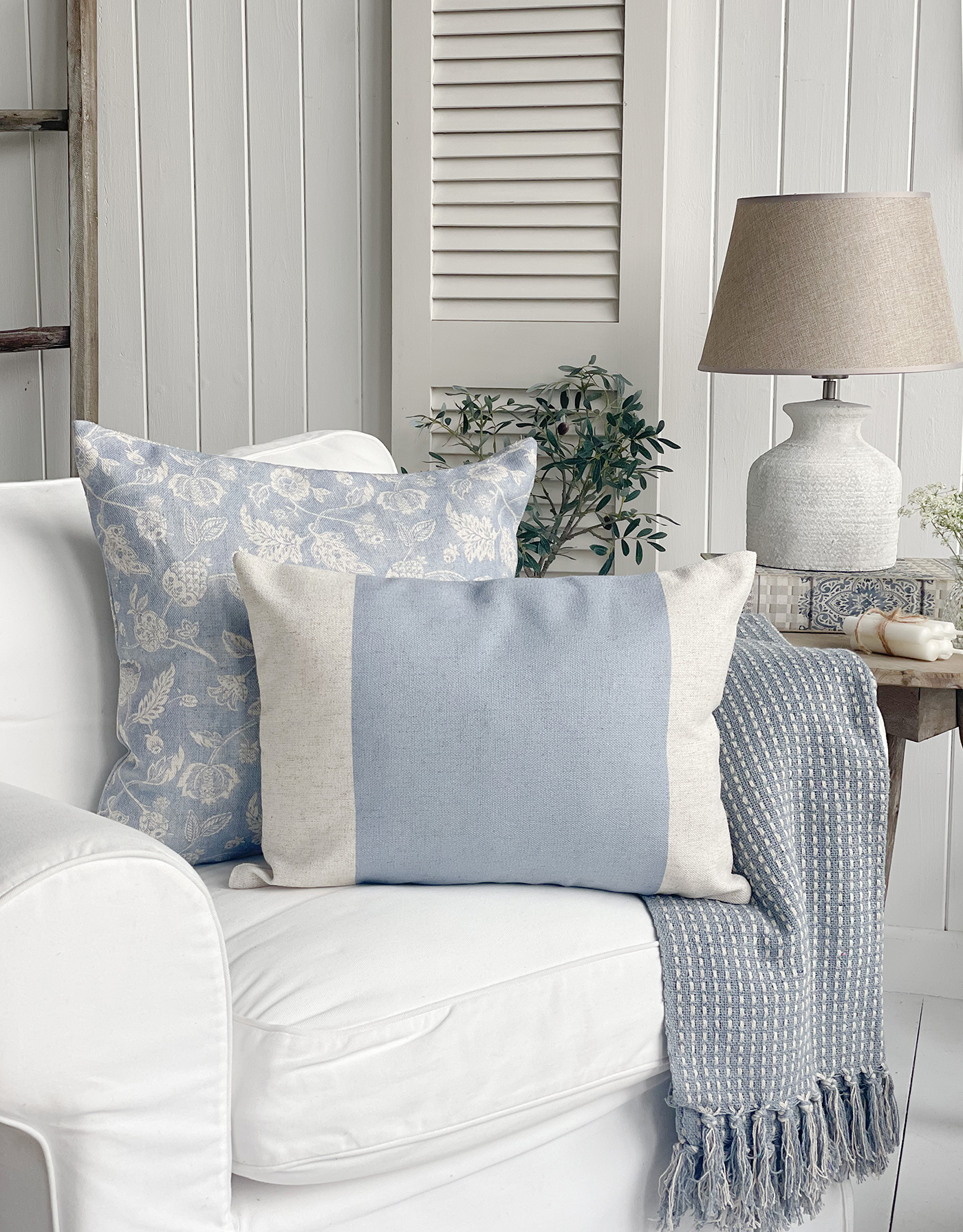 New England Meredith cushions in pale blue and natural.