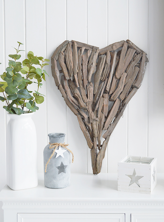 A decorative heart made from pieces of driftwood that can be wall hung or set on a shelf or table top.  In a rustic styled finish, the heart can be incorporated into a country, cottage or coastal interior design.