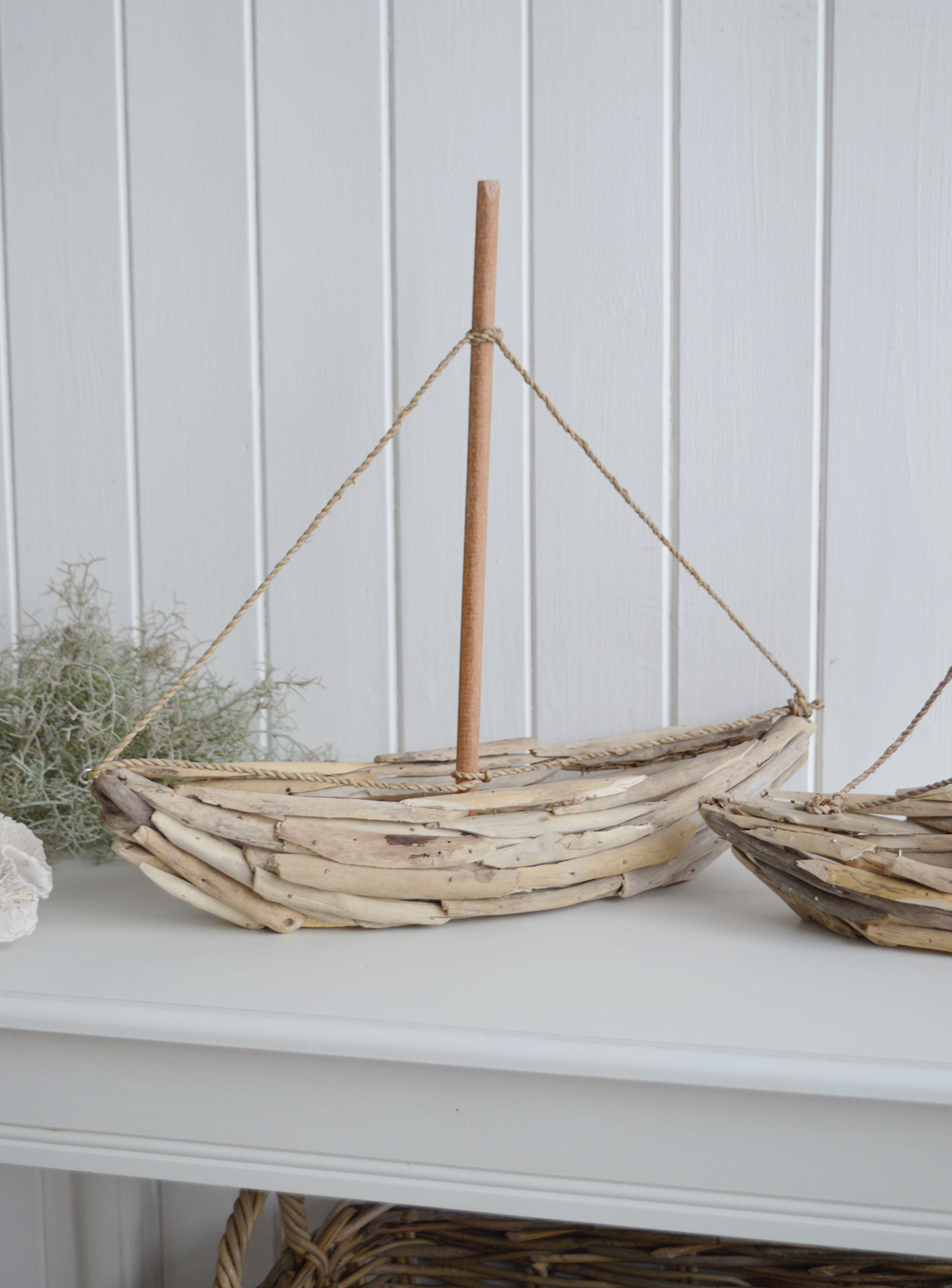 Decorative sailboat made from natural driftwood for nautical and coastal interiors