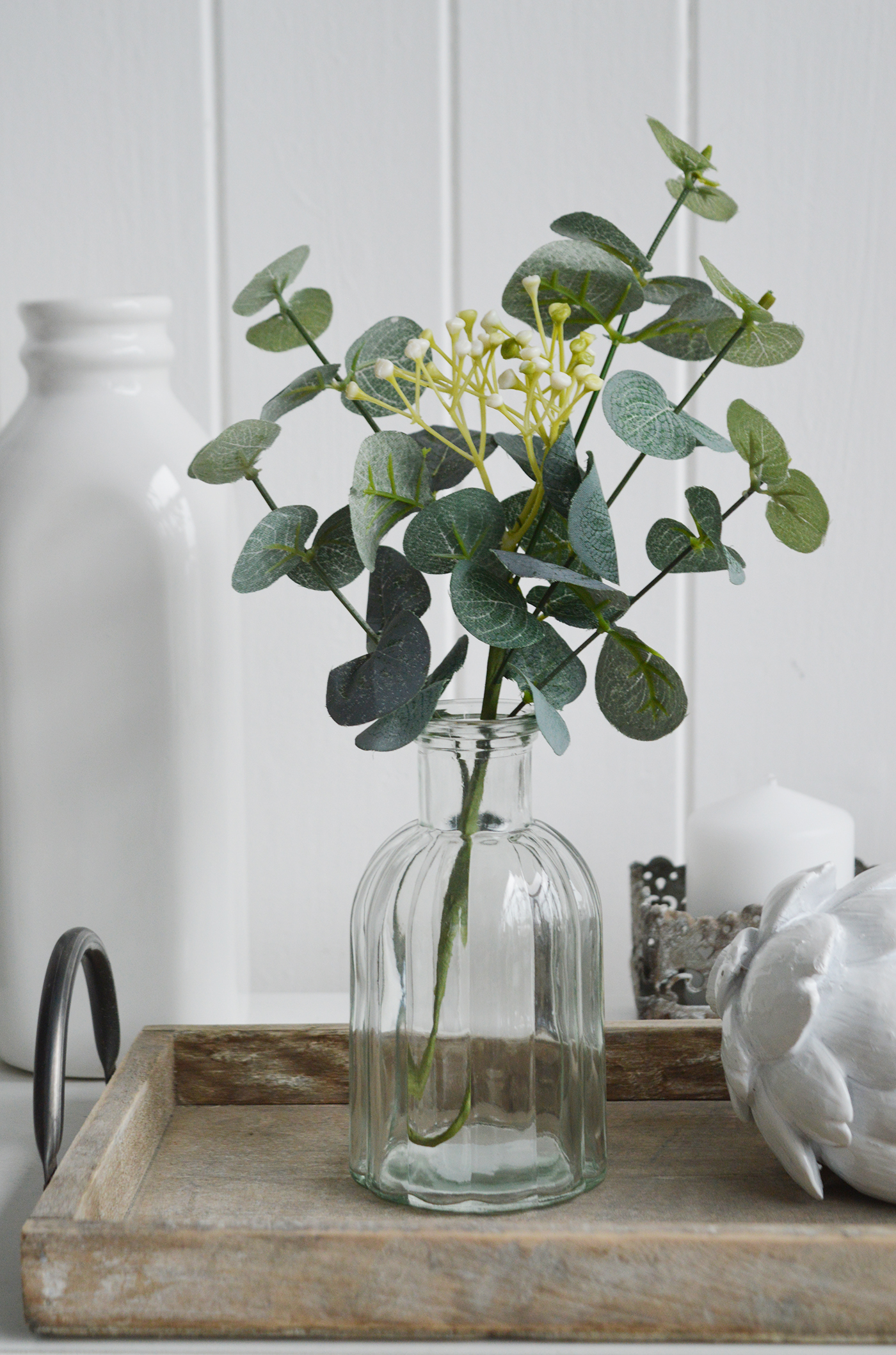 Artificial Eucalyptus sprig with white flowers. Simple greenery to add to New England styled interiors for coastal, country, city and farmhouse homes