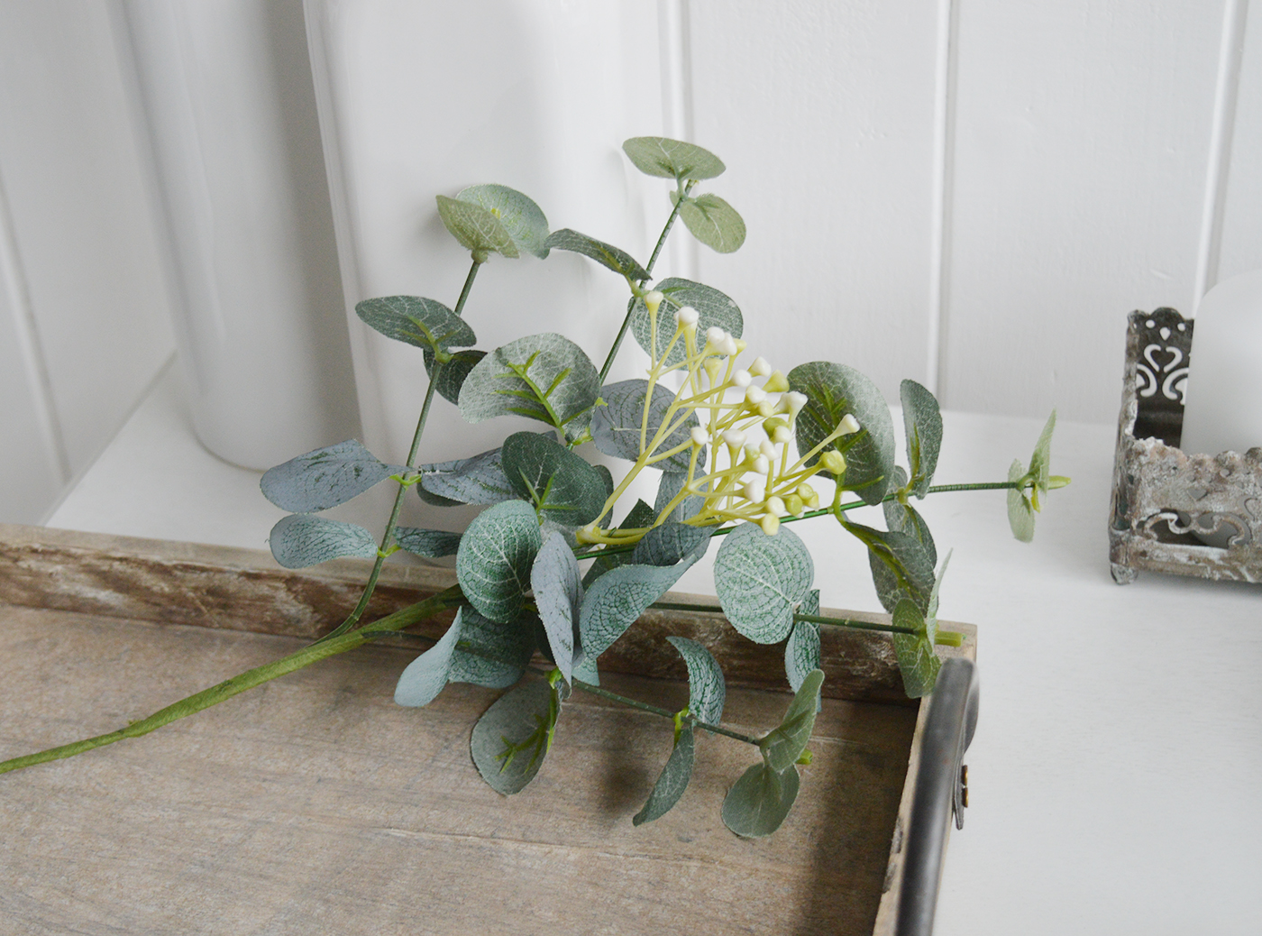 Artificial Eucalyptus sprig with white flowers. Simple greenery to add to New England styled interiors for coastal, country, city and farmhouse homes