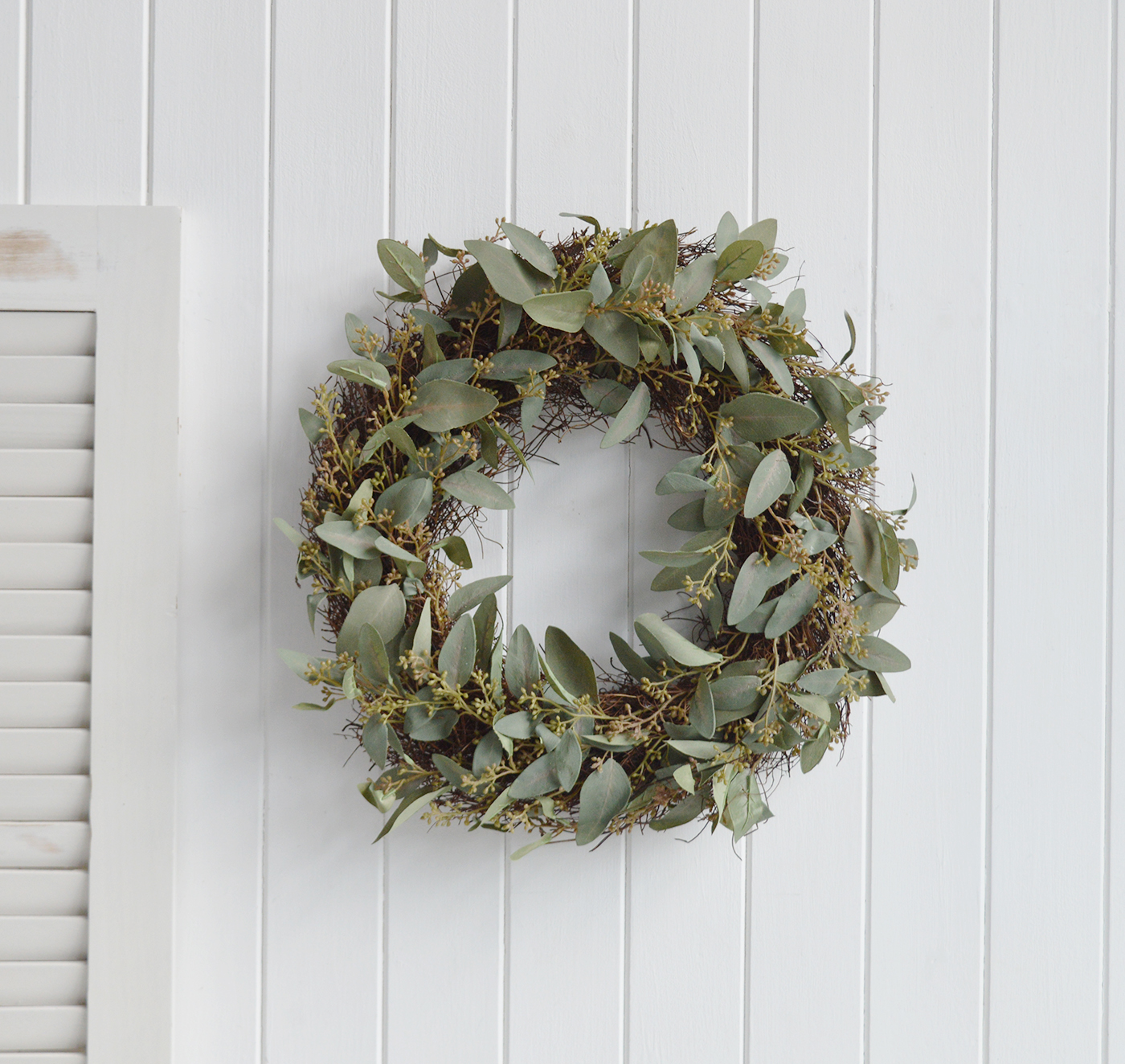 A beautilly crafted faux Eucalyptus wreath to give timeless New England style