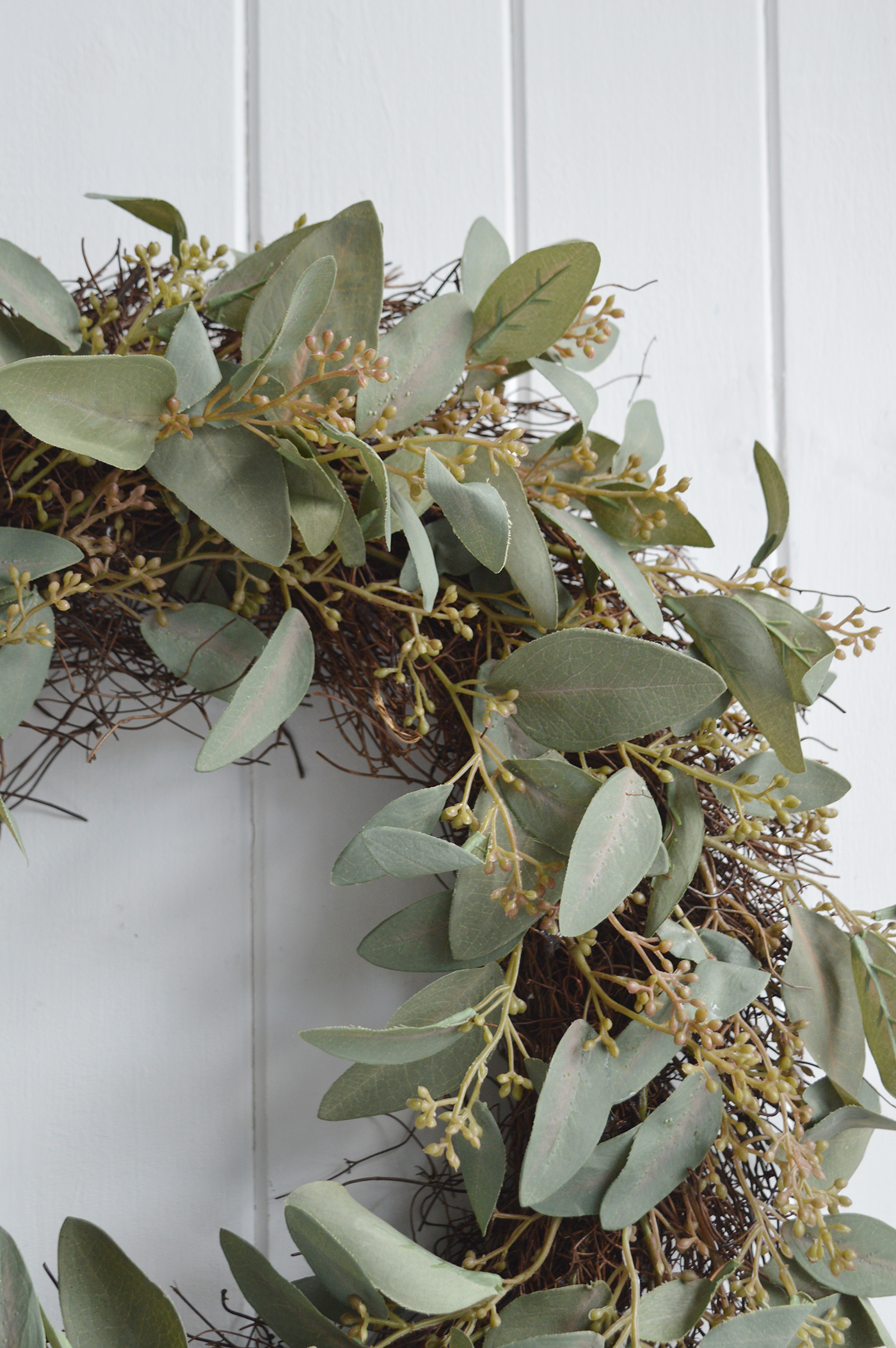 A close up of the faux Eucalyptus greenery entwined on the twig base