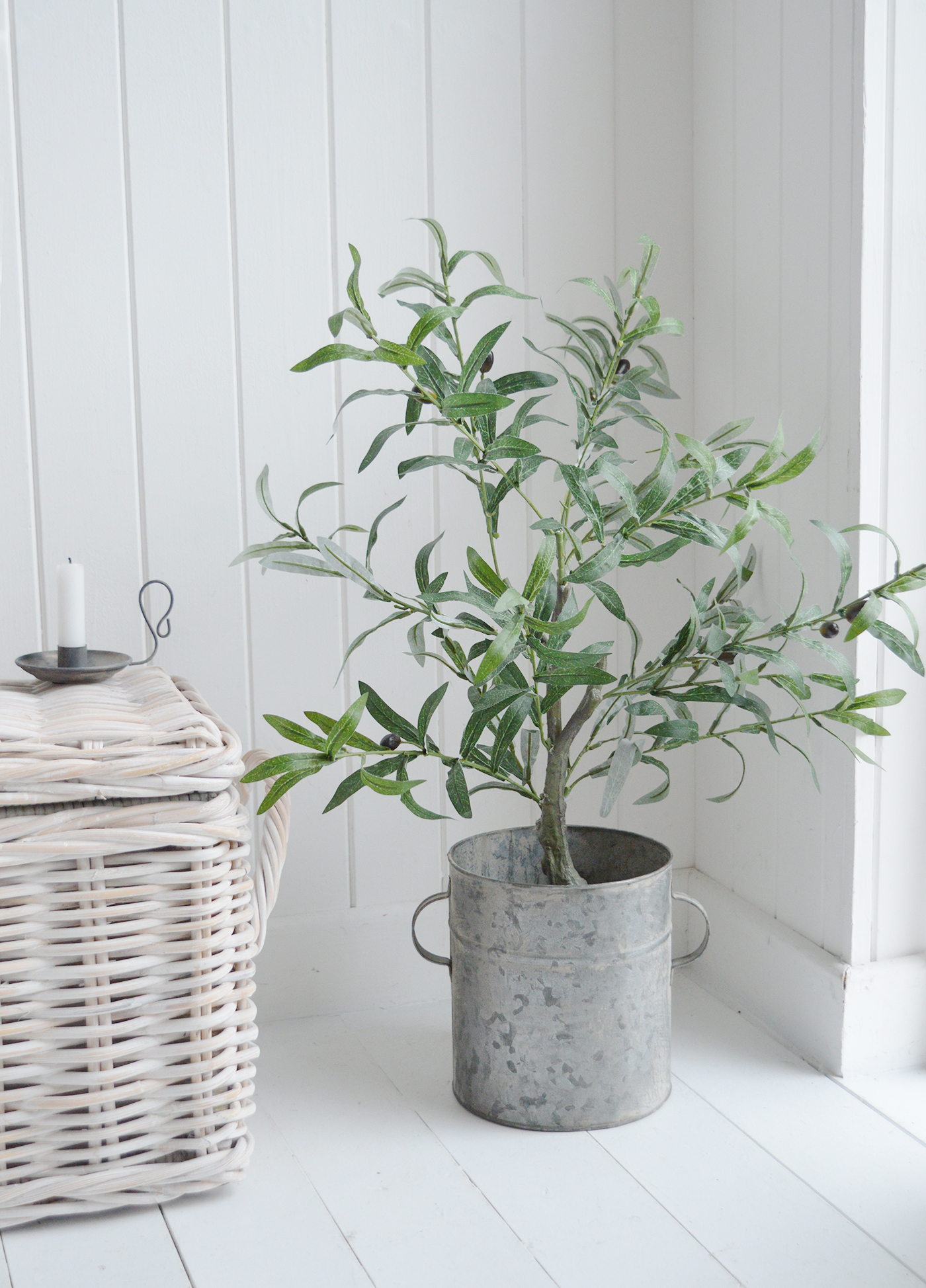 Faux olive tree in a zinc pot