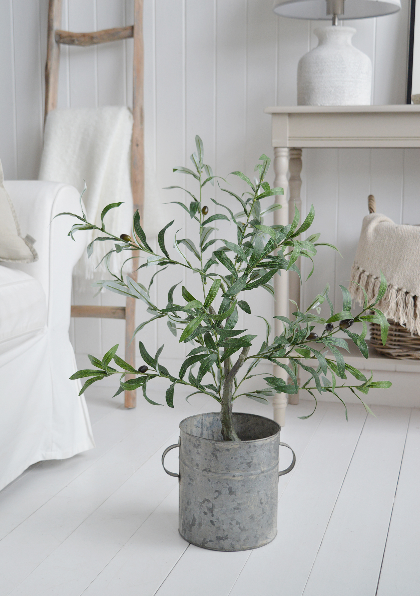 Our faux olive tree in the zinc tub pot to complement our New England style of interiors