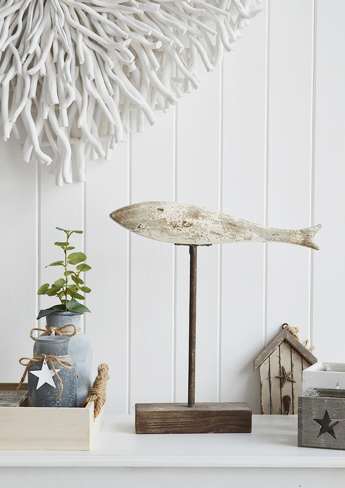 Sitting on top of a weathered stand, the large distressed wooden fish in whites, blues and greys will definitely make a statement in a coastal styled home. The White Lighthouse Furniture