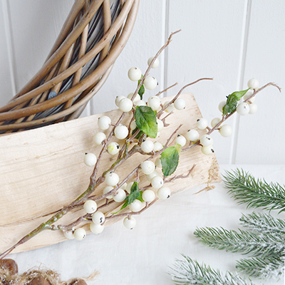Faux white berries sprig for winter decoration. Simple greenery to add to New England styled interiors for coastal, country, city and farmhouse homes