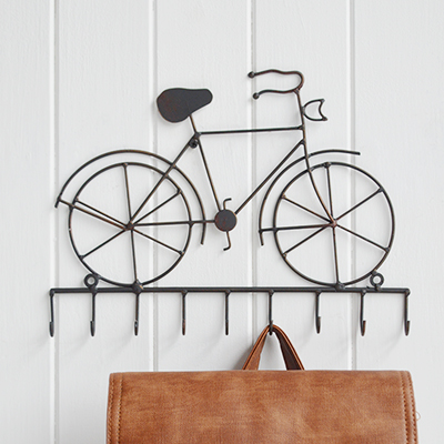 Antiqued metal bicycle hooks for New England style home interiors