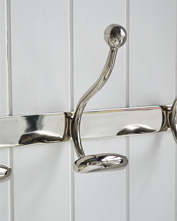 Polished silver coat hooks