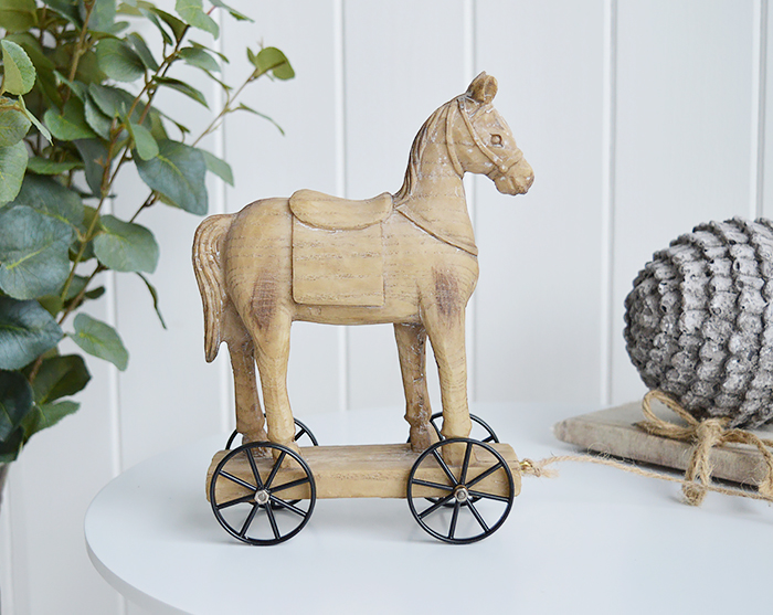 A carved wooden effect decorative horse on wheels from The White Lighthouse Coastal furniture