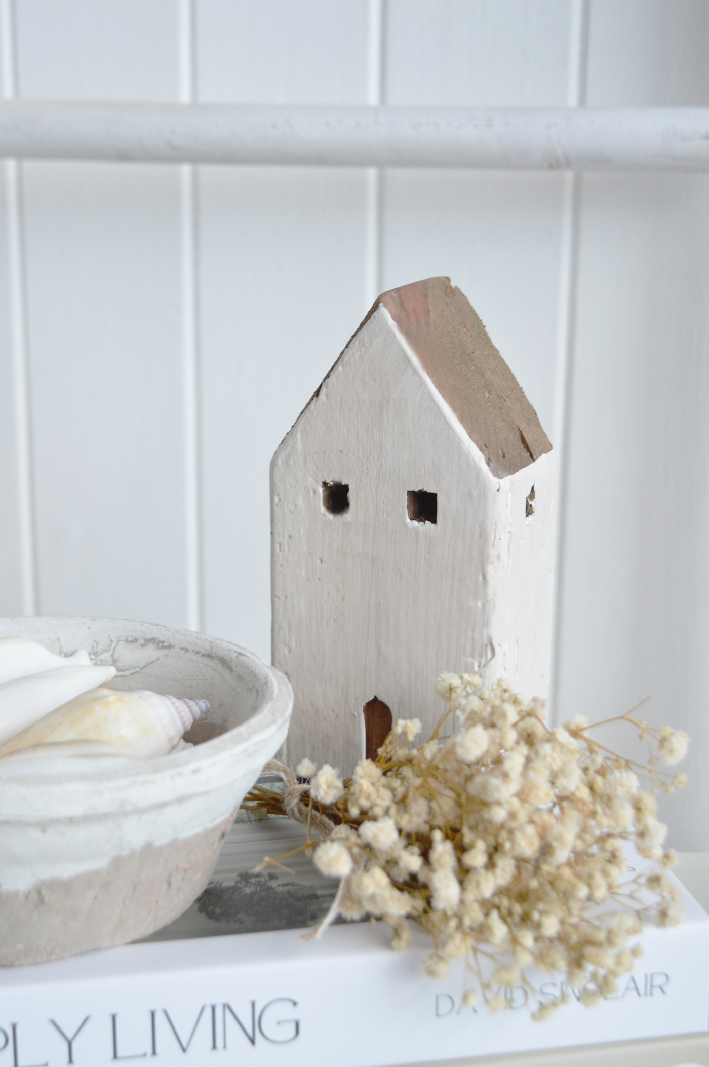 This distressed wooden house ornament is the perfect accessory for coastal interiors, adding texture and warmth to neutral home décor.
