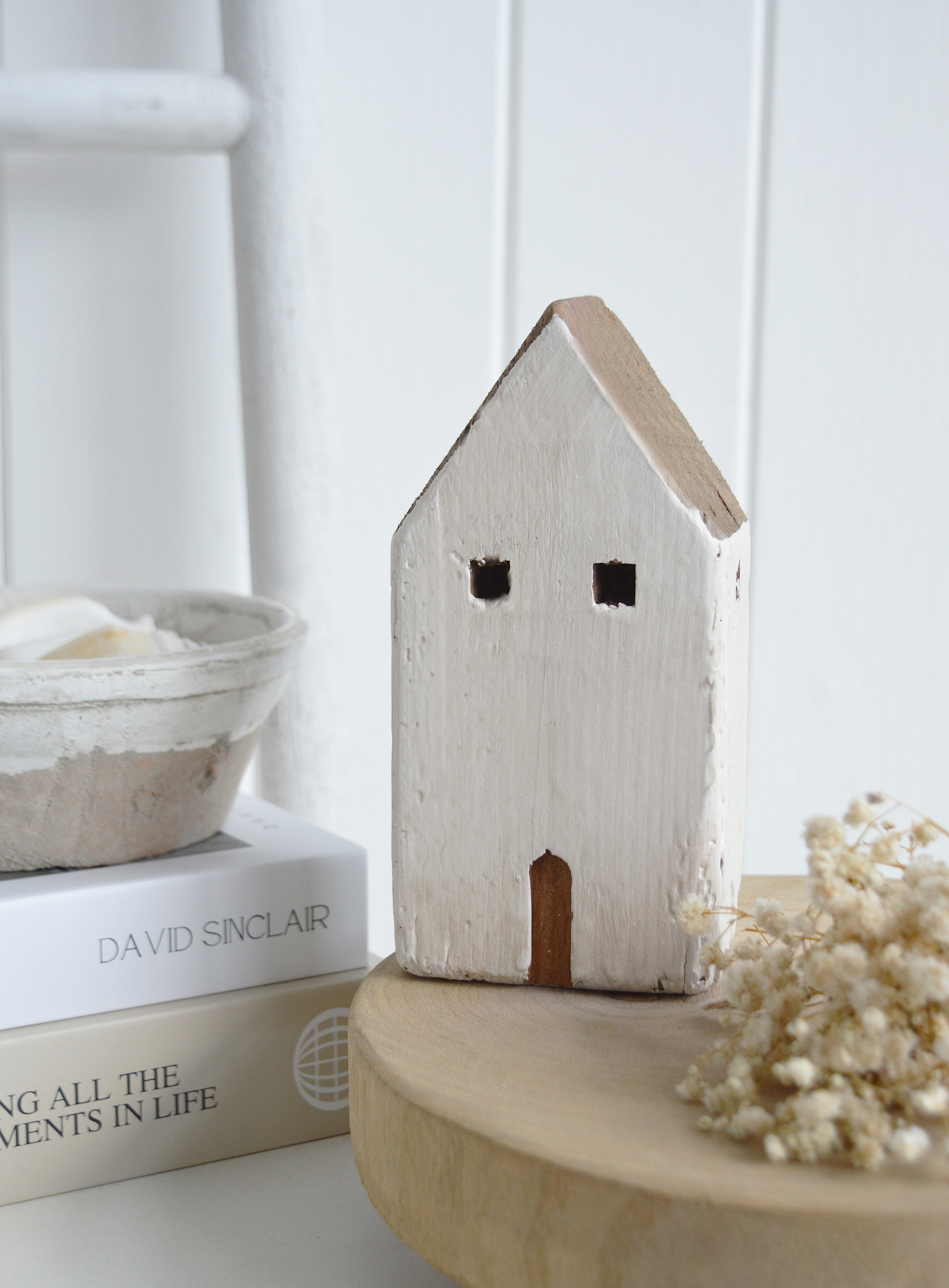 The chalky white finish and natural wood detail make it ideal for modern coastal and modern country interiors. A timeless neutral home accessory designed to complement beach house interiors and understated, elegant spaces.