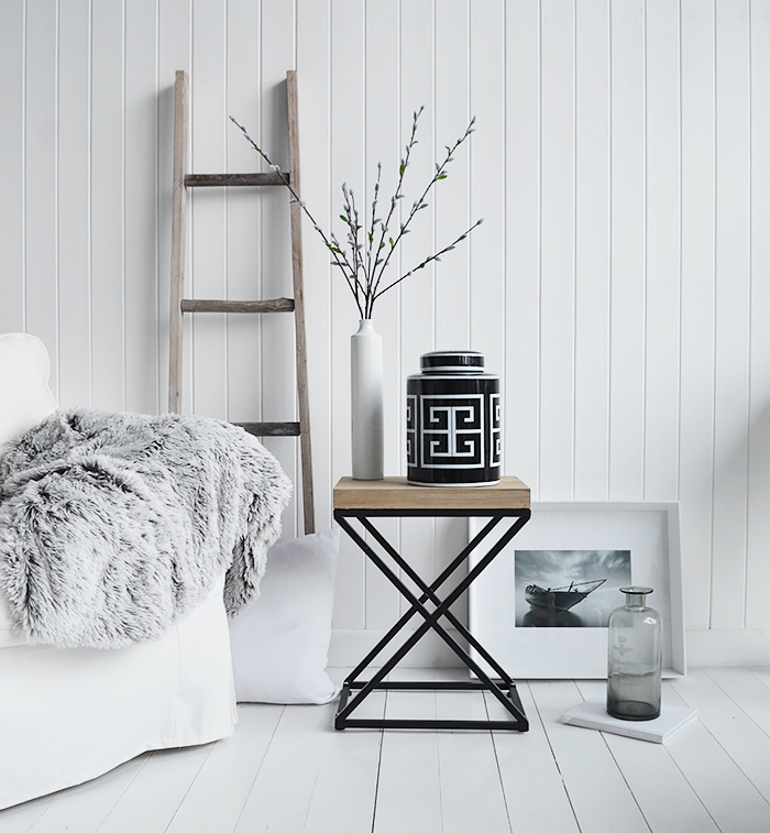 A black and white palette is timeless. Mixed with natural materials, cushions and throws with plently of texture and interest gives a classic New England look to your interior.