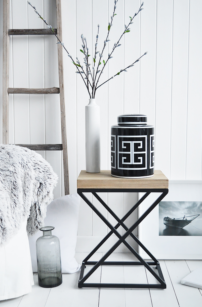 A black and white palette is timeless. Mixed with natural materials, cushions and throws with plently of texture and interest gives a classic New England look to your interior.