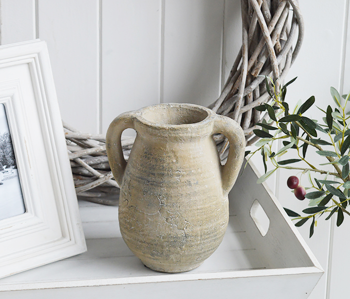 A rusctic grey stone jar with handles. 

Vintage charm and texture are in abundance with our beautiful piece of stoneware. 

In a grey stone finish, it is perfect to fill with our faux Eucalyptus or olive stalks.  for New England interiors and home style