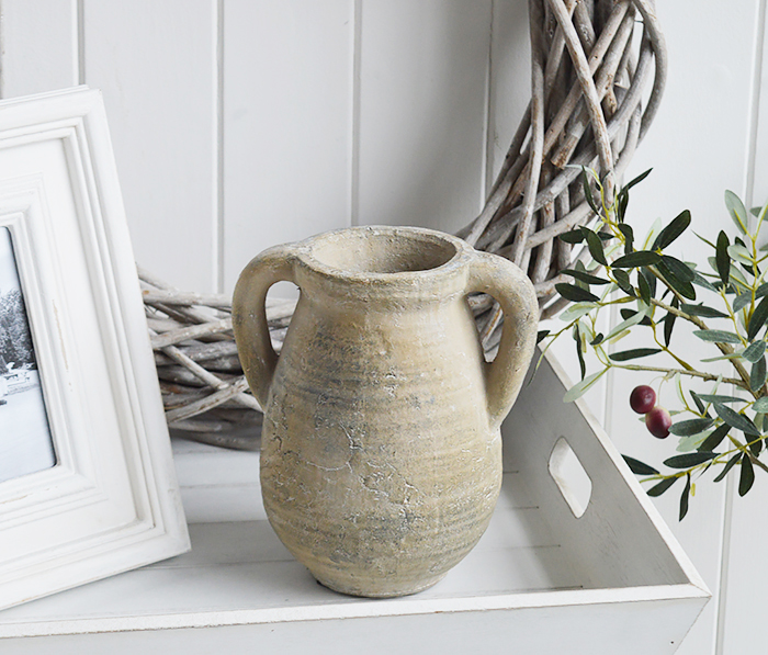 A rusctic grey stone jar with handles. 

Vintage charm and texture are in abundance with our beautiful piece of stoneware. 

In a grey stone finish, it is perfect to fill with our faux Eucalyptus or olive stalks.  for New England interiors and home style