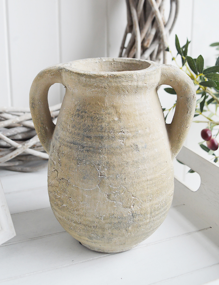 A rusctic grey stone jar with handles. Vintage charm and texture are in abundance with our beautiful piece of stoneware. In a grey stone finish, it is perfect to fill with our faux Eucalyptus or olive stalks. 