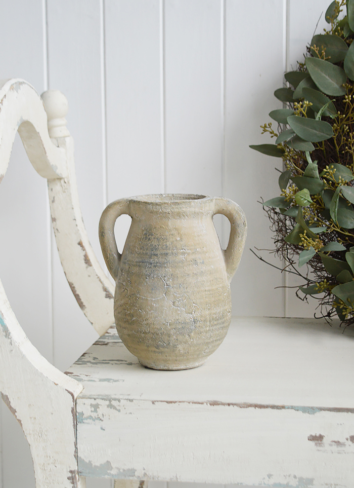 A rusctic grey stone jar with handles. 

Vintage charm and texture are in abundance with our beautiful piece of stoneware. 

In a grey stone finish, it is perfect to fill with our faux Eucalyptus or olive stalks. 