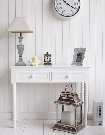 White magazine holder beside hall table