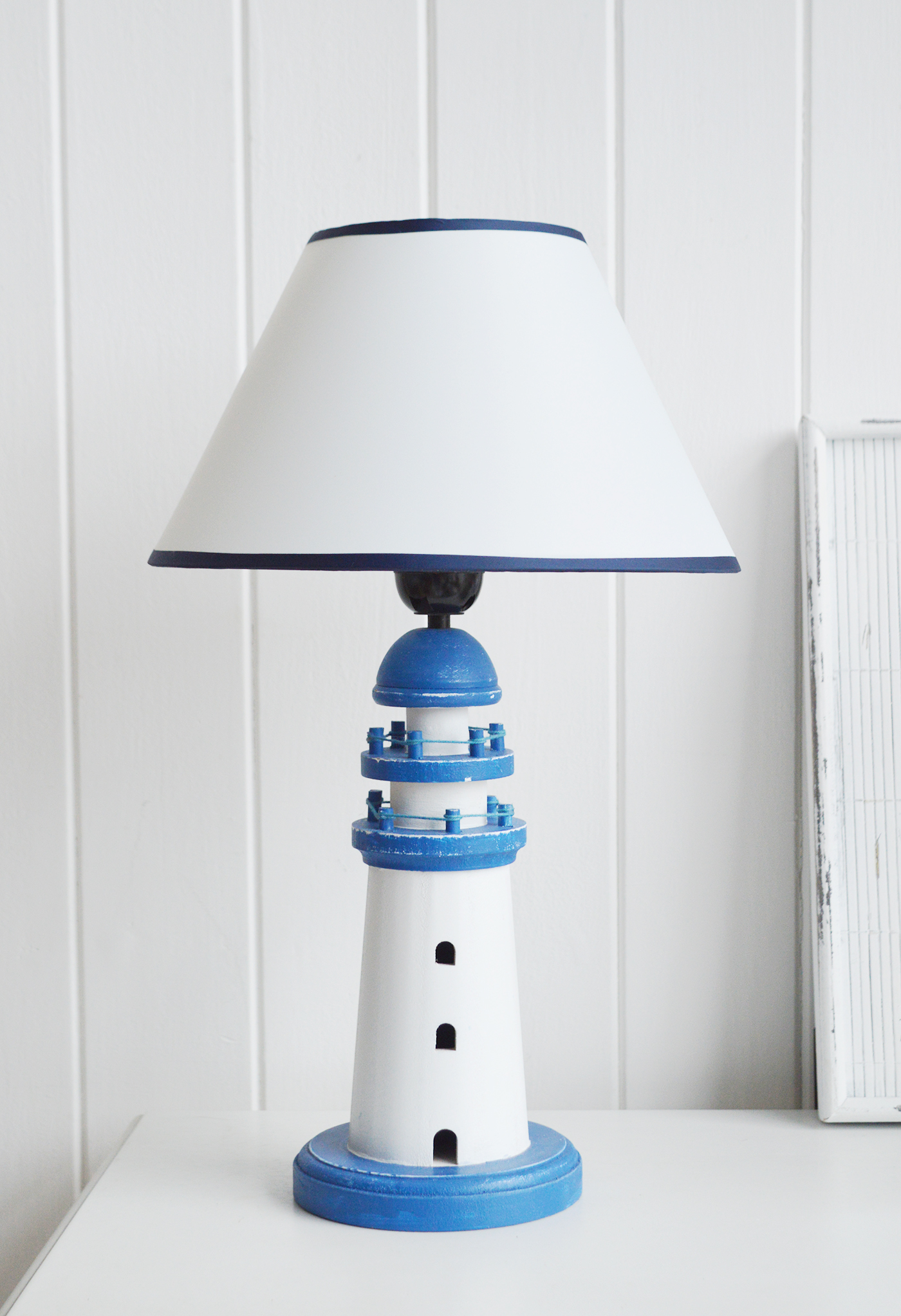 Lighthouse Blue and White table lamp from The White Lighthouse Furniture. A lovely table lamp for bedside table or living room. New England furniture and interiors for coastal, country and city homes. 