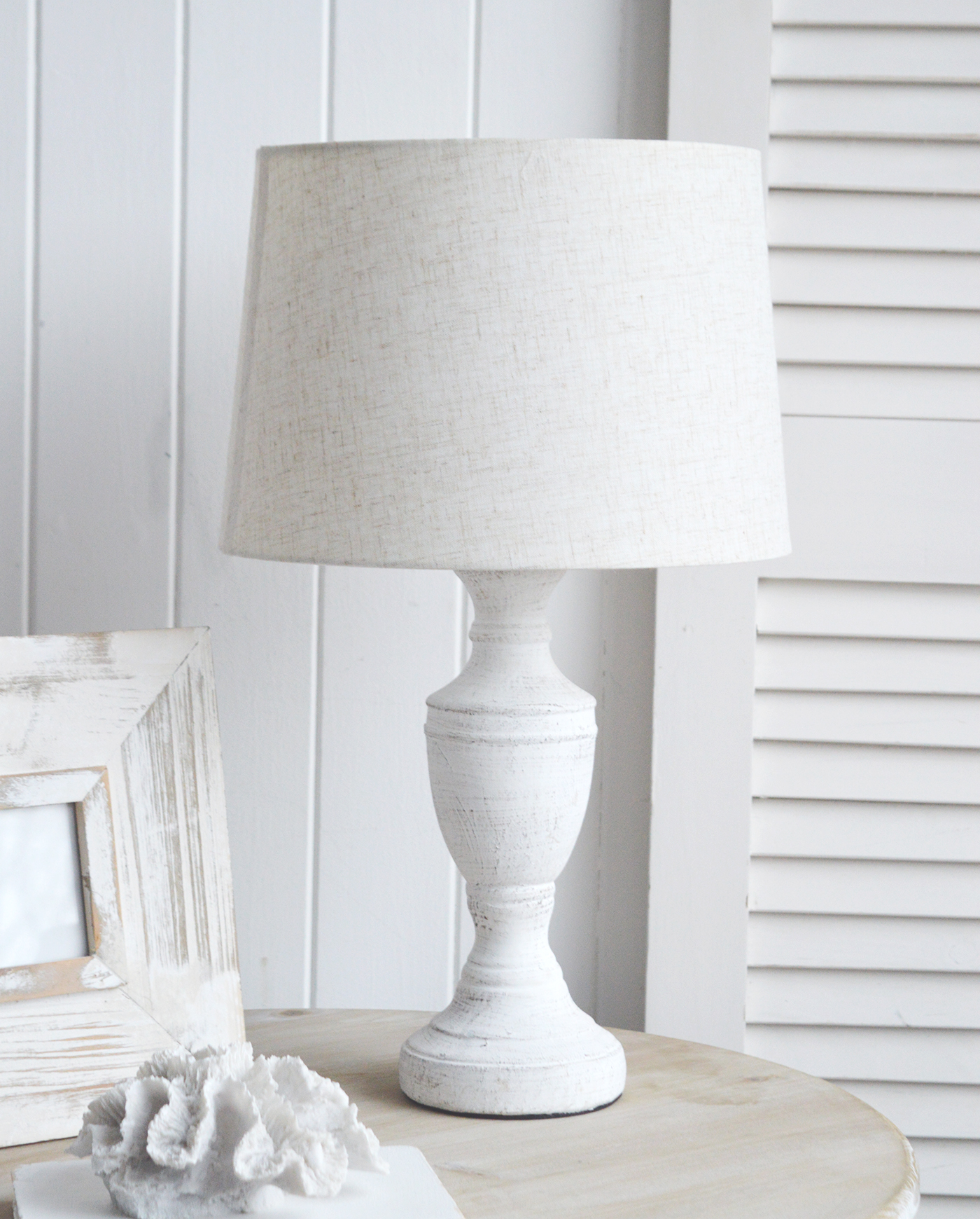 The Rockport table lamp in rustic stone for a coastal vibe in a New England styled interior