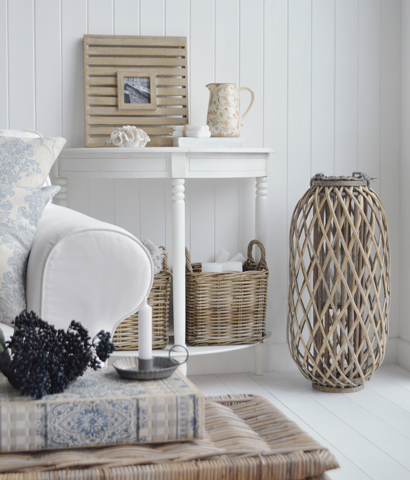An example of modern farmhouse and coastal style furniture and how each complements each other. The grey willow large lantern againes the white furniture in the Cape Anne range