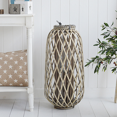 Our extra large gorgeous rustic woven lantern in white willow with chunky rope handles and glass inserts for candles.

These lanterns are ideal finishing touches for country and charming coastal displays but will complement any decor scheme in your home