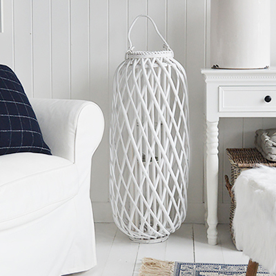 Our extra large gorgeous rustic woven lantern in white willow with chunky rope handles and glass inserts for candles.    These lanterns are ideal finishing touches for country and charming coastal displays but will complement any decor scheme in your home