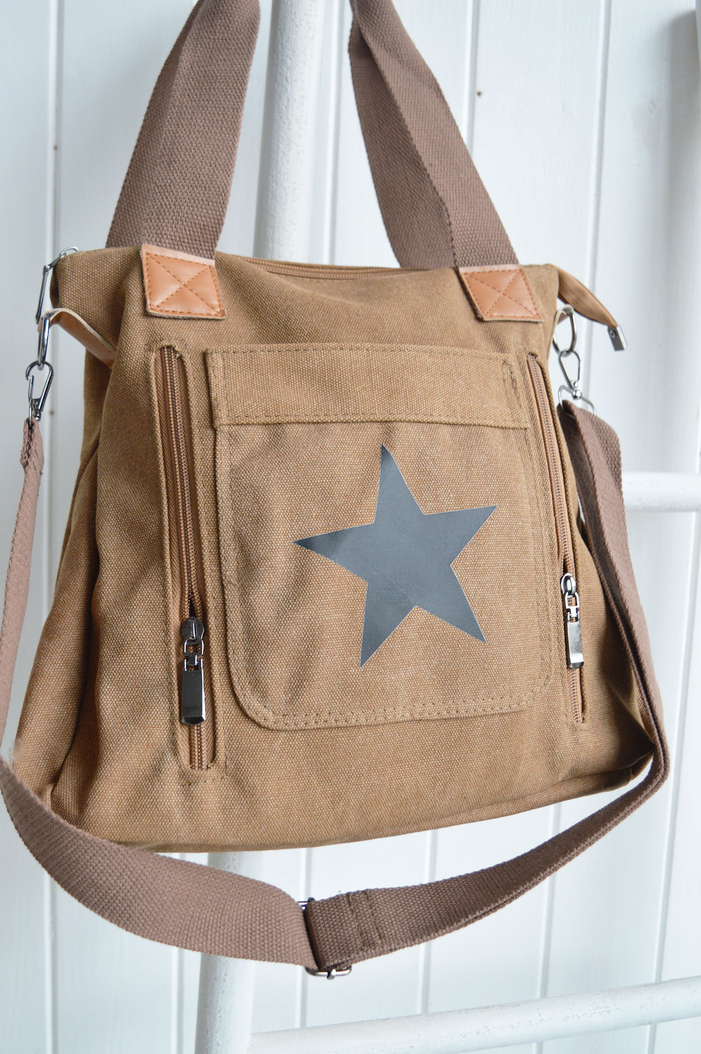 Multiple zipped pockets provide practical storage for phones, keys, purses and all your daily essentials.