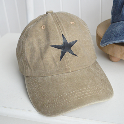 The Sand Star Cap brings a soft, neutral warmth to your look, inspired by coastal dunes and designed to complement relaxed beach house style.