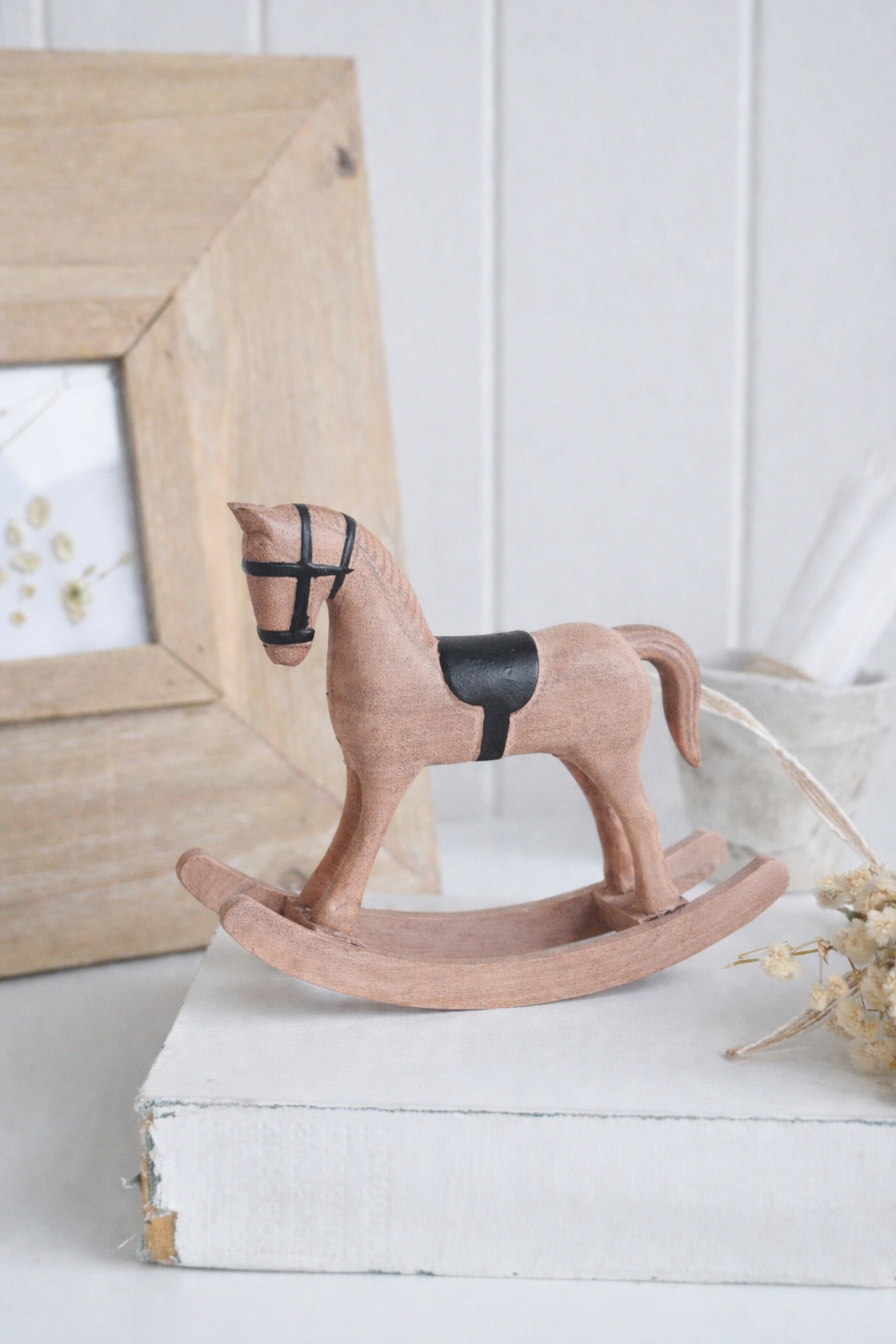 This decorative rocking horse is a timeless styling piece for neutral, New England and farmhouse interiors.