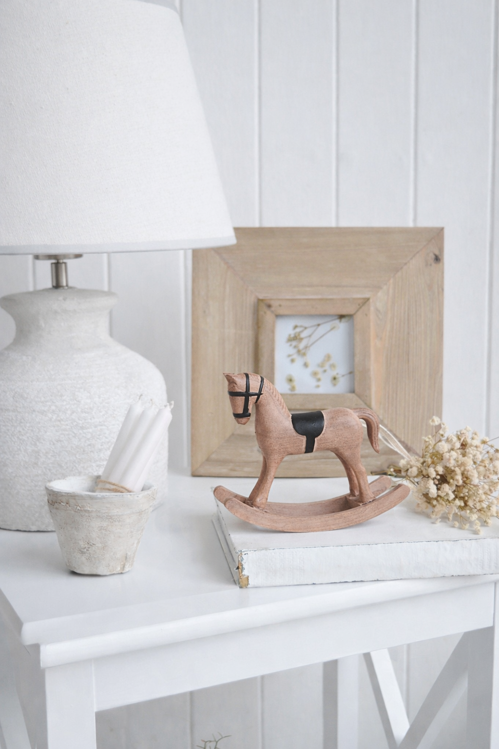 Finished in a soft, weathered finish, this small rocking horse ornament adds gentle character to shelves and side tables.