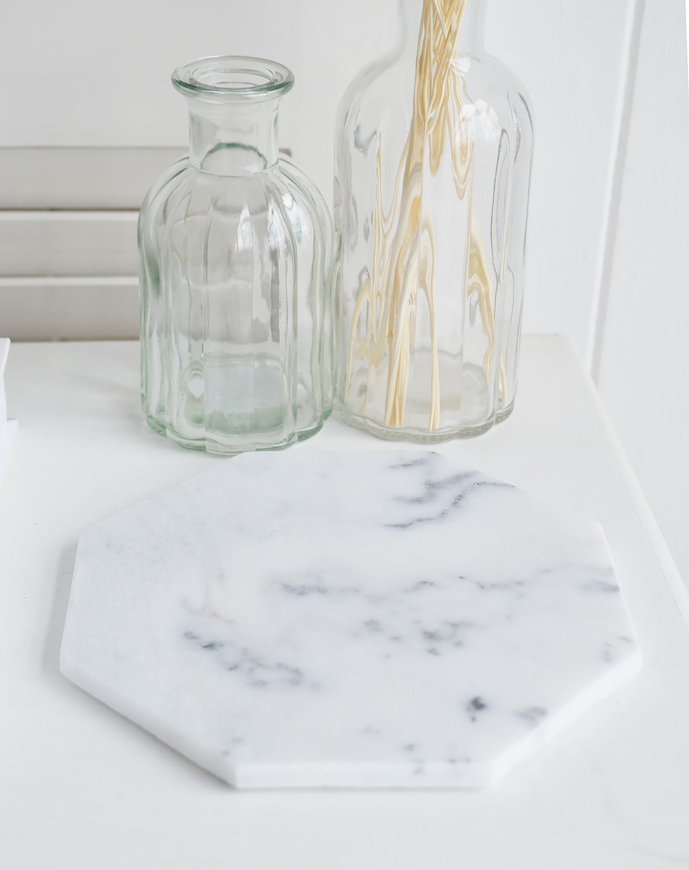 A white marble tray from The White Lighthouse furniture and accessories. New England style interiors for coastal, country, city and farmhouse styled homes